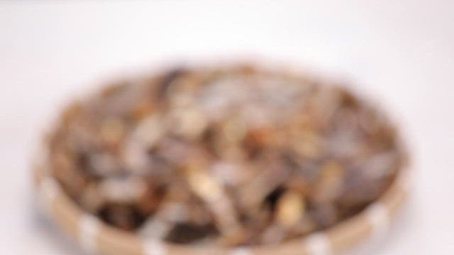 Basket of dried anchovies on a table