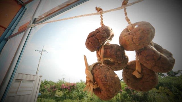 Lump of soybean paste hung outdoors to dry