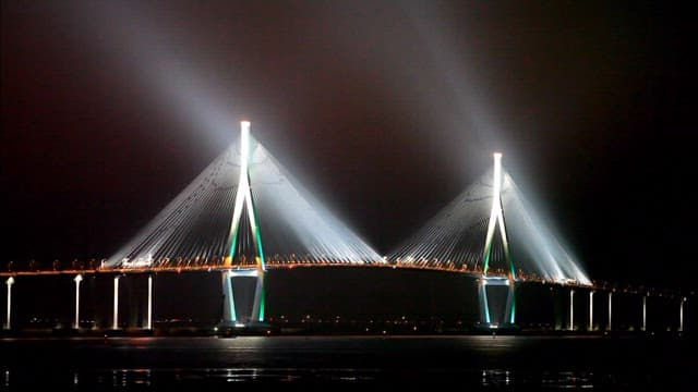 Incheon Bridge with lights on the water at night