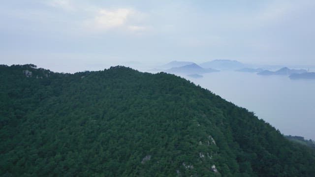 Misty mountain landscape with distant islands