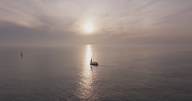 Yacht sailing at sunset on the sea