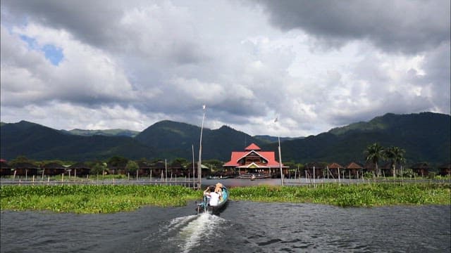 Boat ride towards traditional village on Inle lake