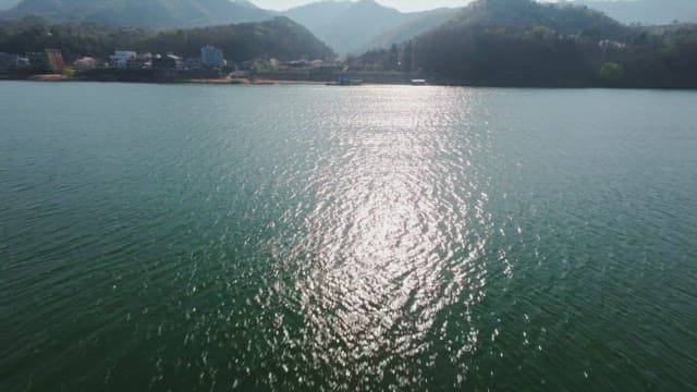 Serene river with distant mountains