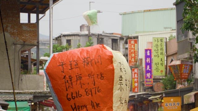 Giant Lanterns among Bustling Street Market