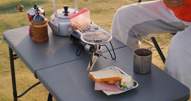 Outdoor camping with a portable stove and coffee