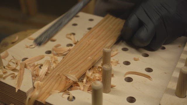 Wood carving with a chisel