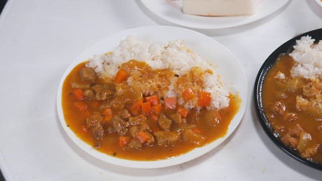 Curry Rice with Plenty of Carrots Served on the Table