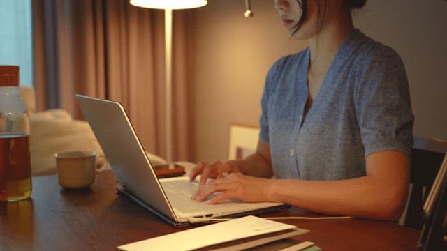 Woman working on laptop at home