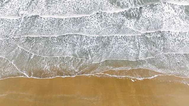Waves gently lapping on a sandy beach