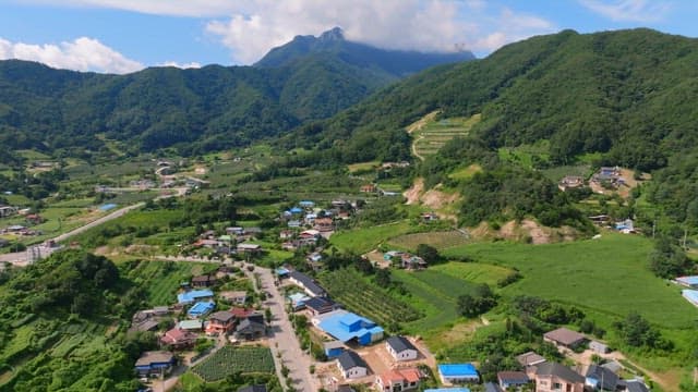 Green mountains under a blue sky