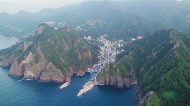 Coastal town nestled between mountains