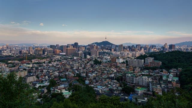 Bustling city skyline from day to night