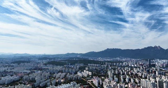 Sprawling cityscape with distant mountains