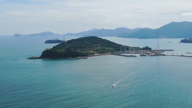Green island surrounded by the sea