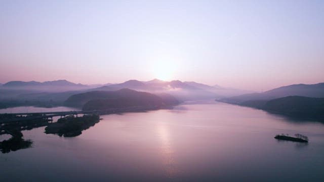 Serene Sunset Over a Tranquil River Landscape