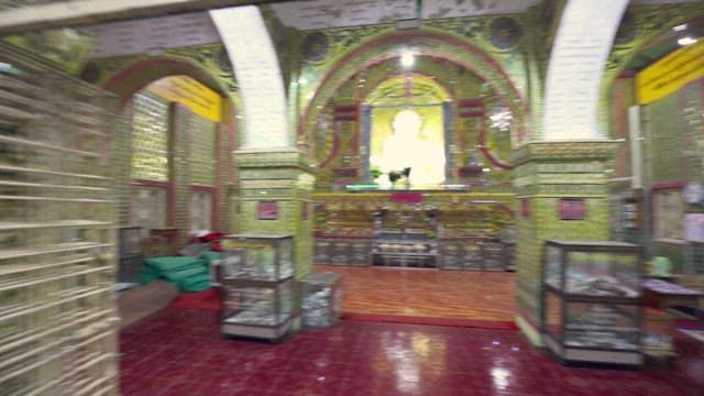 Interior and Exterior Views of a Temple at Night