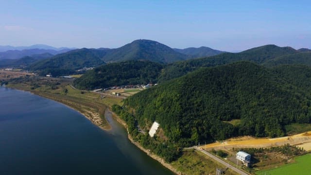 Serene mountain landscape with river and village