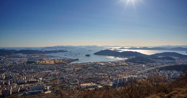 Day to night views of the city along the coastline