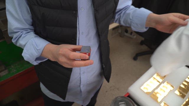 Person working with metal tools indoors