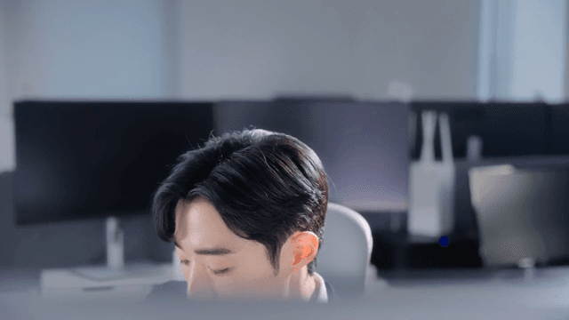 Focused man working at a desk in an office
