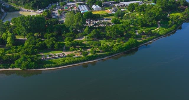 Serene village surrounded by the river and lush greenery