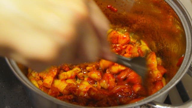Cooking pork with gochujang in a pot
