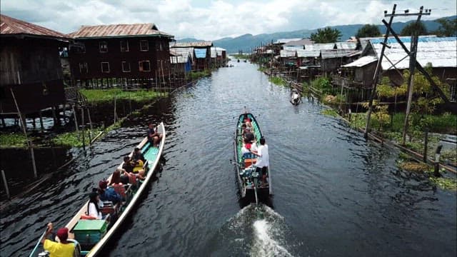 Boats Speeding Across a Scenic Inle Lake