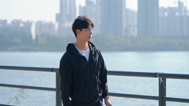 Man drinking water while walking