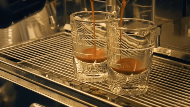 Preparing Espresso in Glass Cups at a Café