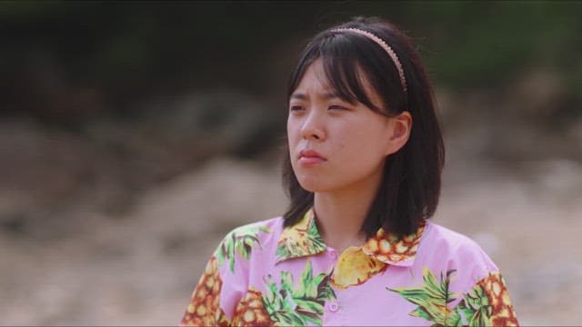 Woman checking her pink floral shirt
