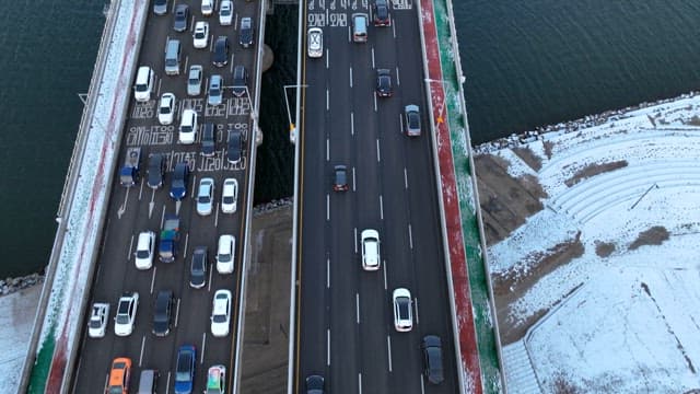 Aerial View of Busy Urban Bridge Traffic