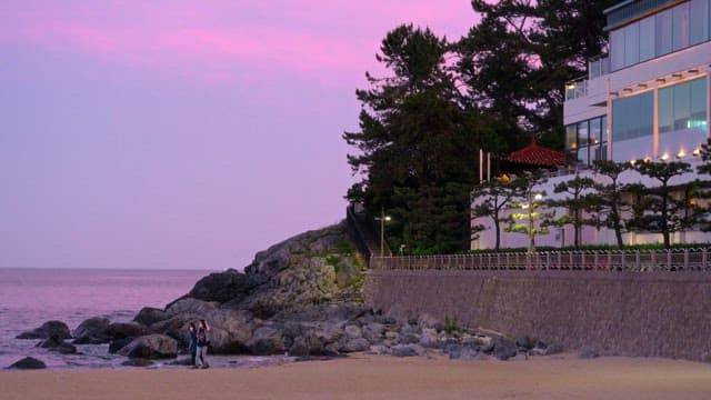 Sunset by the Beach With People and Building