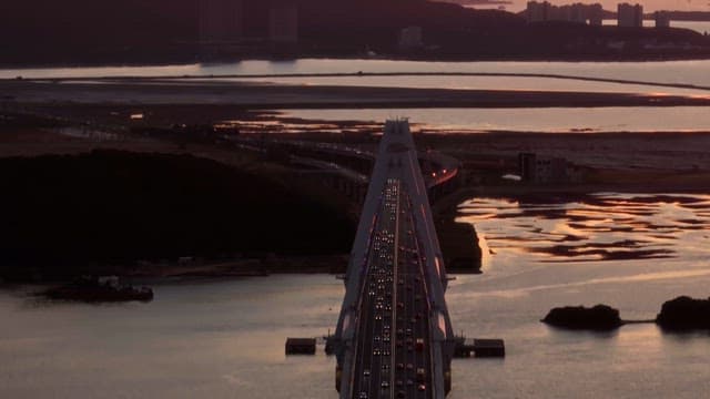 Bridge with heavy traffic at sunset
