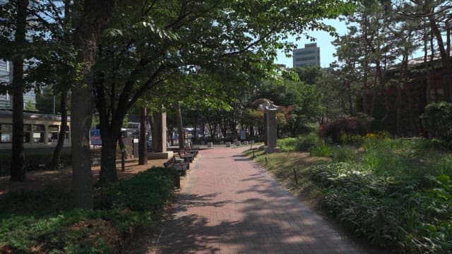 Quiet urban park surrounded by trees and buildings