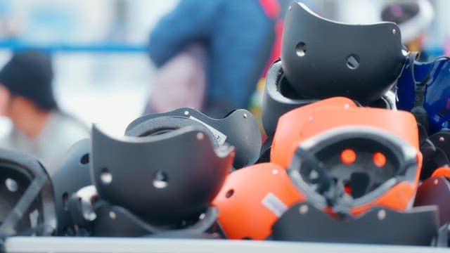 Stack of skate helmets