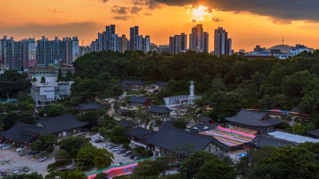 Temple at dusk with city skyline