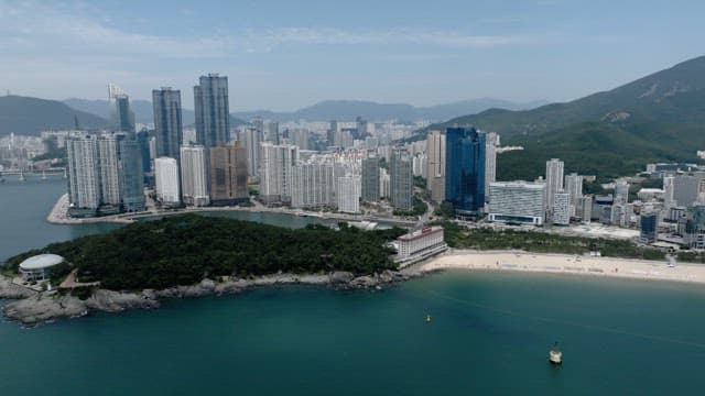 Coastal Cityscape with Skyscrapers and Beach