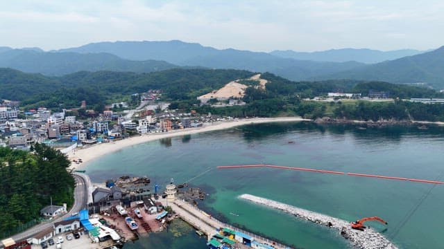 Coastal town with mountains and sea
