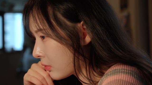 Woman deep in thought indoors