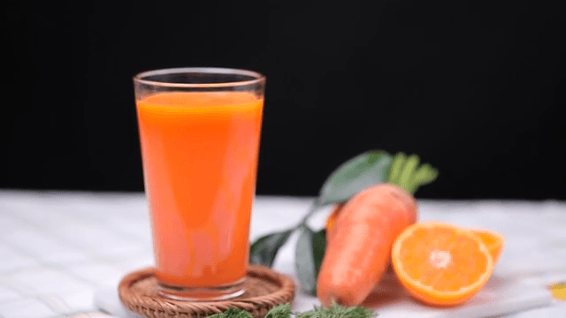 Carrot and carrot juice on a table