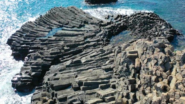 Columnar joint formed by cooling lava on the coast