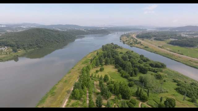 Serene river flowing through lush greenery