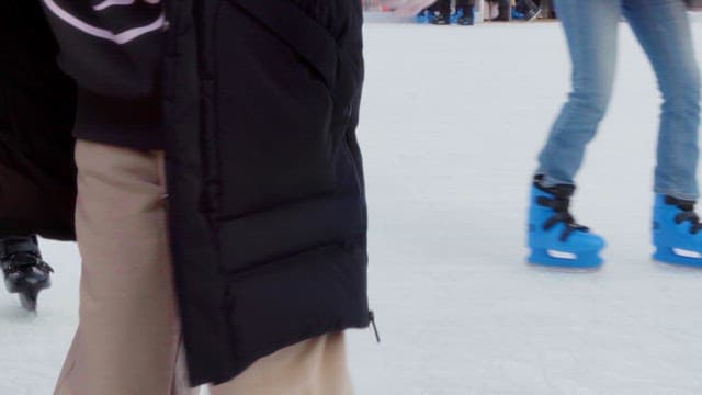 People ice skating on a rink