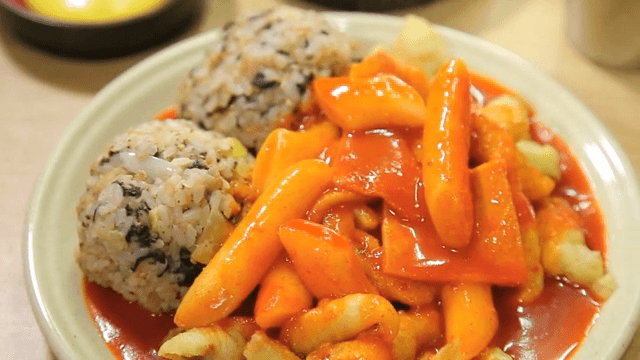Plate of spicy tteokbokki and rice balls