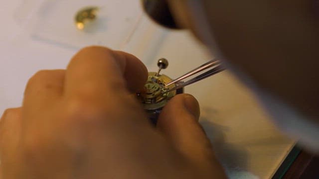 Expert Craftsman Repairing Intricate Watch Parts