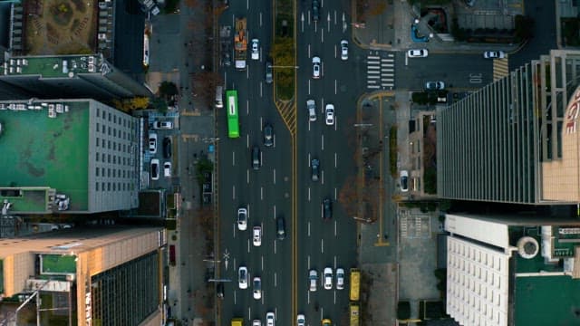 Busy Traffic in a City Center with Many Buildings