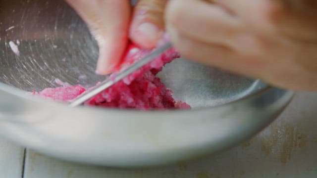 Radish being cut on a steel plate
