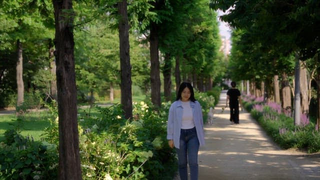 Woman walking in a sunny park