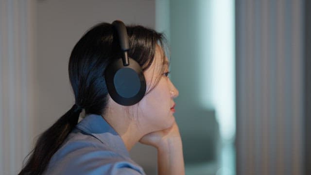 Woman listening to music with headphones