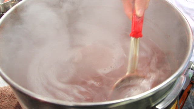 Red bean soup boiling in a pot in the kitchen